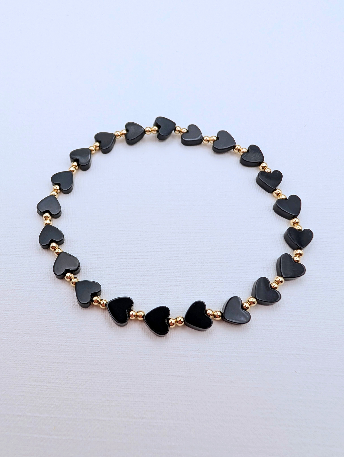 Black Onyx and Gold Heart Bracelet